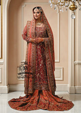 Barn Red red lehenga for a Pakistani wedding ceremony is a Mughal-inspired Bridal dress adorned with lightest hand embroidery and exquisite embellishments that will make you look stunning at your wedding. Fast Shipping available.