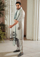 This exquisite kurta embodies sophisticated elegance and timeless grace. Crafted from the finest premium fabrics and meticulously designed with intricate embellishments and delicate sequin work, it exudes understated luxury.