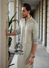 This exquisite kurta embodies sophisticated elegance and timeless grace. Crafted from the finest premium fabrics and meticulously designed with intricate embellishments and delicate sequin work, it exudes understated luxury.