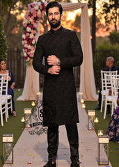 A sophisticated Black classic sherwani, and beautifully executed with intricate hand embroidery featuring sequins and beads. It is designed for versatility.