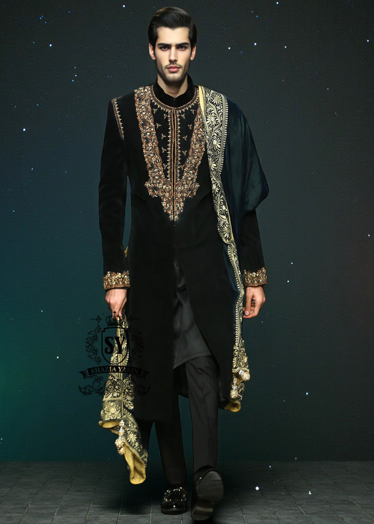 This jet black cocktail velvet form-fitting sherwani is the epitome of elegance. Its impeccable design and luxurious velvet fabric exude a touch of royalty.