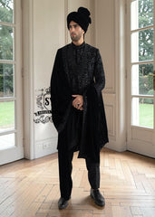 The Full Hand-Embroidered Black Sherwani is a masterpiece of couture, created for the groom who wishes to embody elegance, power, and tradition. Hand embroidery adorns the sherwani in lavish detail, transforming it into a regal statement piece.