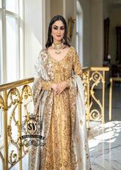 Our radiant Bride shining in the elegant angrakha pishwan, crafted from luxurious silky lame and adorned with exquisite embellishments. Let this gold outfit accentuate your captivating beauty!