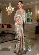 Designer Couture Saree Wedding dress with an open Back Blouse adorned with 3D flowers and a soft pleated Saree
