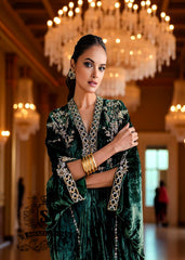 Woman in a green traditional Kaftan outfit with gold jewelry in an elegant indoor setting