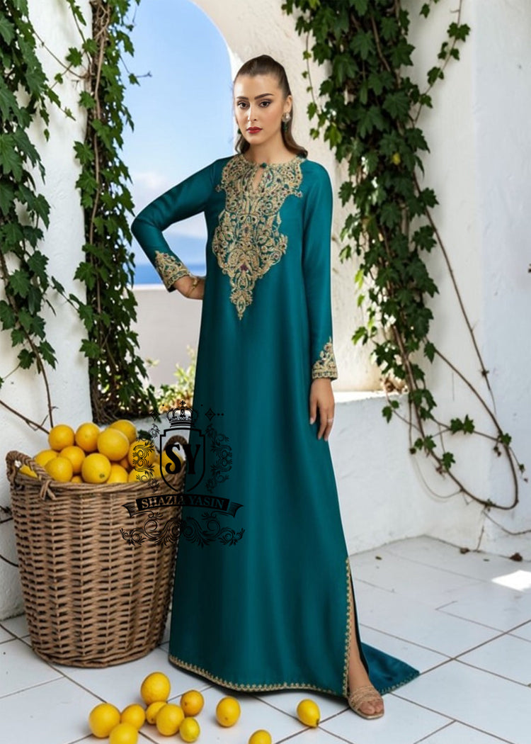 As wedding season blooms, make a sophisticated statement with our exquisite Teal Kaftan dress, crafted from pure raw silk and embellished with intricate dapka, naqshi, and cutdana embroidery. Every detail is carefully designed to highlight your unique radiance and individuality, perfect for any special occasion where you want to be the most spectacular.