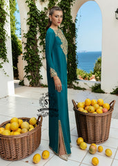 As wedding season blooms, make a sophisticated statement with our exquisite Teal Kaftan dress, crafted from pure raw silk and embellished with intricate dapka, naqshi, and cutdana embroidery. Every detail is carefully designed to highlight your unique radiance and individuality, perfect for any special occasion where you want to be the most spectacular.