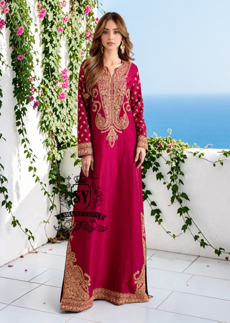 Truly stunning. This Big dip o’ruby raw silk Kaftan is perfect for evening occasions. Delicate Marori embroidery by skilled artisans adorns the sleeves and hem, creating a classic feel. For any celebration this season.