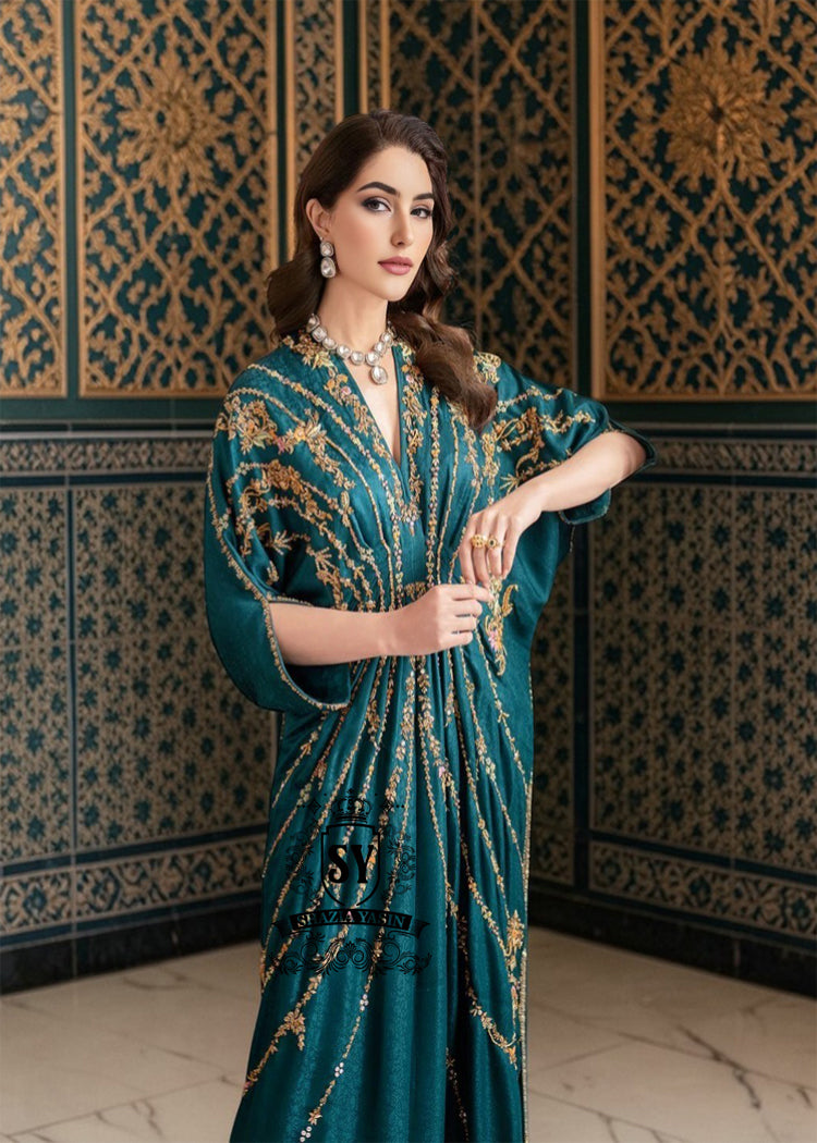 A full-length yet sensual colored Kaftan gown with trendy gathers, could have been the perfect wedding guest—The Kaftan dress, with its X-shaped draping, It has the same character: it will look luxurious both on the red carpet and at the wedding reception.
