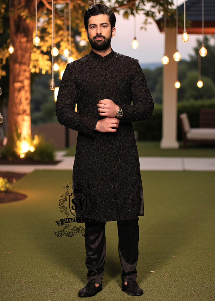 A sophisticated Black classic sherwani, and beautifully executed with intricate hand embroidery featuring sequins and beads. It is designed for versatility.