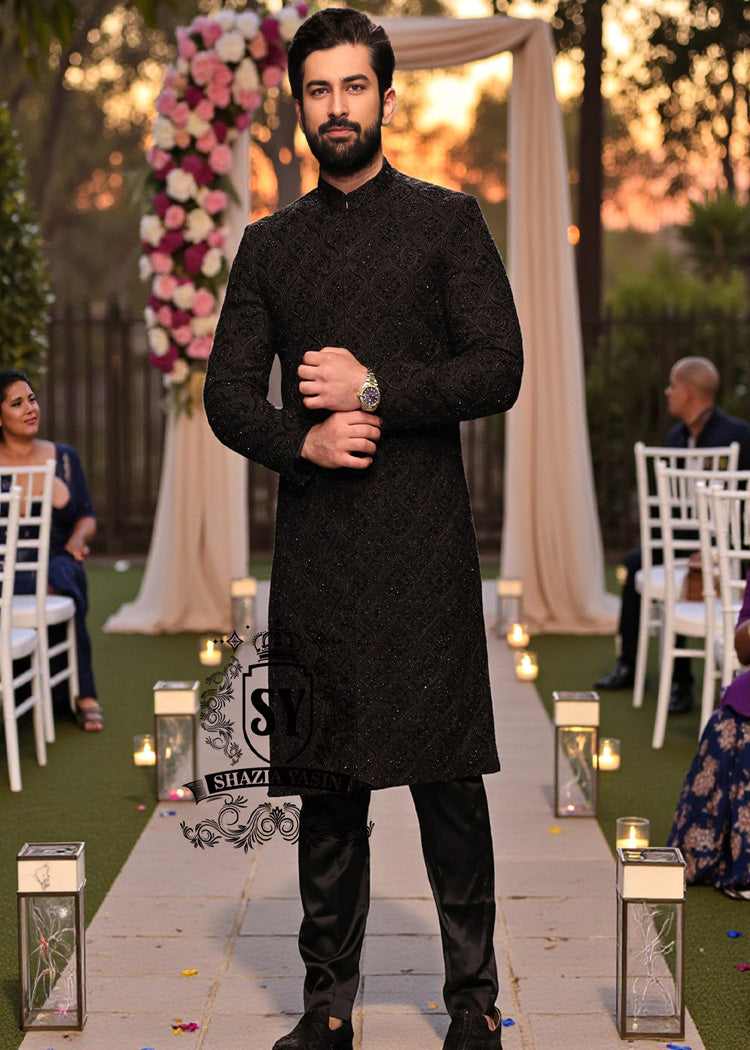 A sophisticated Black classic sherwani, and beautifully executed with intricate hand embroidery featuring sequins and beads. It is designed for versatility.