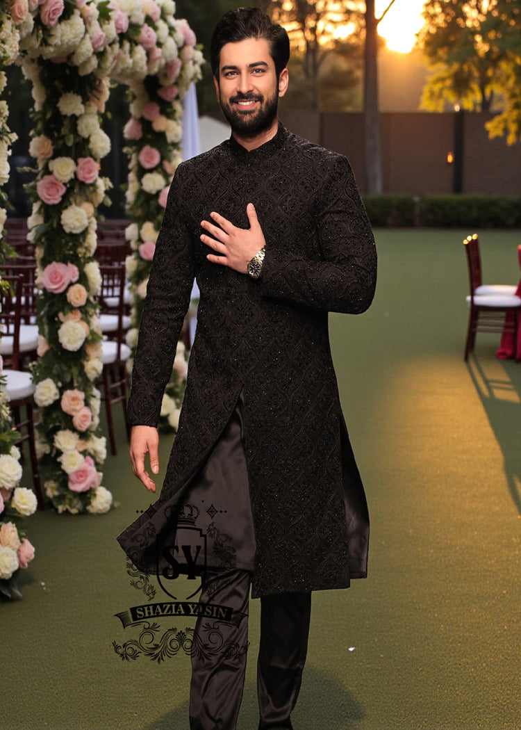 A sophisticated Black classic sherwani, and beautifully executed with intricate hand embroidery featuring sequins and beads. It is designed for versatility.