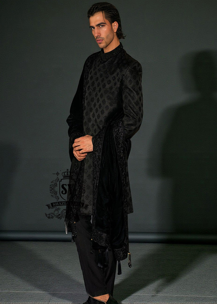 This edgy Sherwani masterpiece from Shazia Yasin is just right for the modern groom, Who wants to make a statement. A Sherwani design that blends classic softness with royal presence.