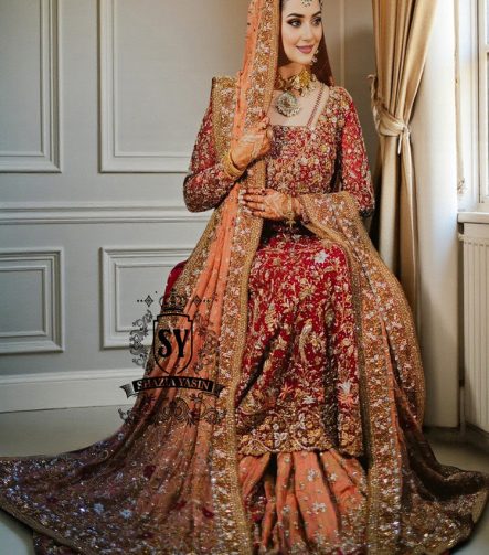 Barn Red red lehenga for a Pakistani wedding ceremony is a Mughal-inspired Bridal dress adorned with lightest hand embroidery and exquisite embellishments that will make you look stunning at your wedding. Fast Shipping available.