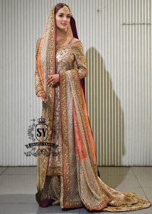 Charming A-line wedding dress with long Fully embellished sleeves and a boat neckline, with a voluminous princess-style lehenga skirt with a spectacular train.