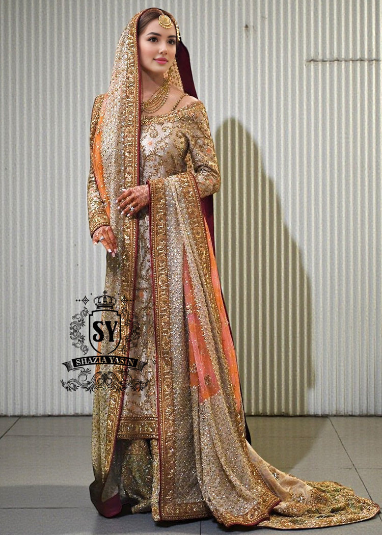 BridalDress192A Charming A-line wedding dress with long Fully embellished sleeves and a boat neckline, with a voluminous princess-style lehenga skirt with a spectacular train.