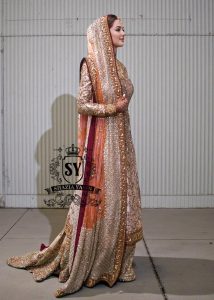 Charming A-line wedding dress with long Fully embellished sleeves and a boat neckline, with a voluminous princess-style lehenga skirt with a spectacular train.