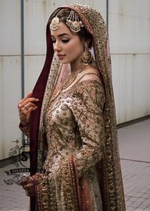 Charming A-line wedding dress with long Fully embellished sleeves and a boat neckline, with a voluminous princess-style lehenga skirt with a spectacular train.