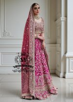 The Dogwood Rose bridal look evokes an aura of ancient majesty. A richly hand-embellished lehenga choli, structured yet flowing, sparkles with dabka details, stones, sequins, beads, silk threads, and Swarovski crystals. Paired with layered raw jewels and a striking jewel-pink dupatta, it captures the grandeur of old-world bridal elegance through a contemporary lens.