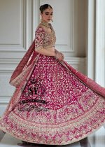 The Dogwood Rose bridal look evokes an aura of ancient majesty. A richly hand-embellished lehenga choli, structured yet flowing, sparkles with dabka details, stones, sequins, beads, silk threads, and Swarovski crystals. Paired with layered raw jewels and a striking jewel-pink dupatta, it captures the grandeur of old-world bridal elegance through a contemporary lens.