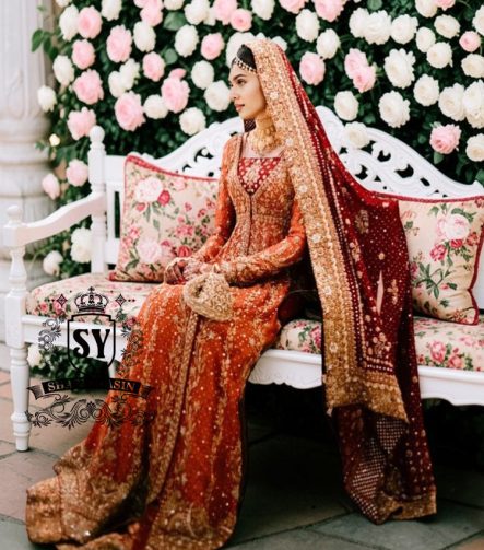 A traditional Pakistani bride epitomizes royal elegance in our newest bridal Pishwas Lehenga dress.