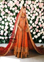 A traditional Pakistani bride epitomizes royal elegance in our newest bridal Pishwas Lehenga dress.