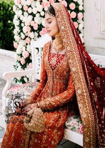 A traditional Pakistani bride epitomizes royal elegance in our newest bridal Pishwas Lehenga dress.