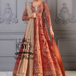 A masterpiece of an embellished long gown, featuring a jamawar bustier, a daring front slit and tulle sleeves with elongated beaded cuffs. Perfect for the red carpet, this Lehenga bridal dress brings Bollywood glamour all the way down the aisle.