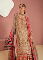 This luxurious, exclusive wedding dress from leading Pakistani designers shimmers with a noble glow in the light. Its majestic Gharara silhouette is perfect for a triumphant entrance, captivating the senses. This look exudes the hand of a true master who understands the value of true beauty.