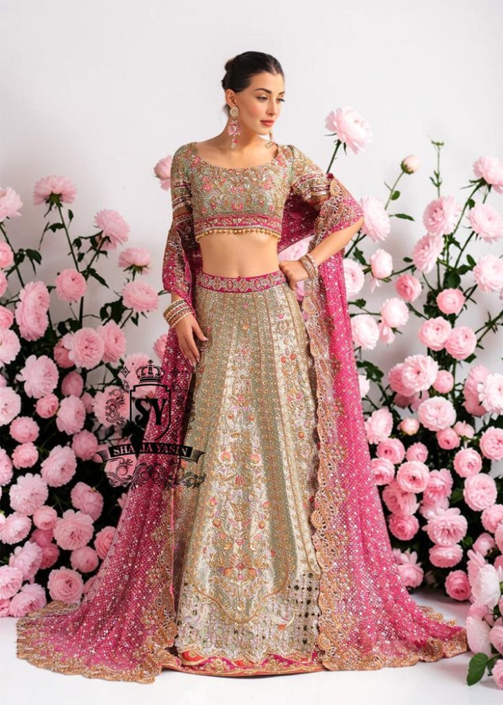 This Bridal dress is the true embodiment of elegance: delicate, silky Lame envelops the Lehenga silhouette, emphasizing every movement. Rich decoration creates a radiant effect - exquisite embroidery with pearls, beads and crystals adds depth and noble shine.