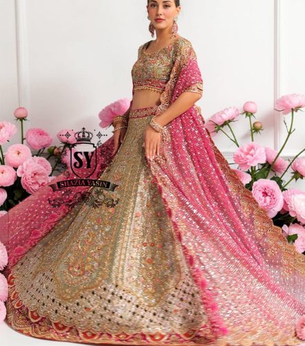 This Bridal dress is the true embodiment of elegance: delicate, silky Lame envelops the Lehenga silhouette, emphasizing every movement. Rich decoration creates a radiant effect - exquisite embroidery with pearls, beads and crystals adds depth and noble shine.