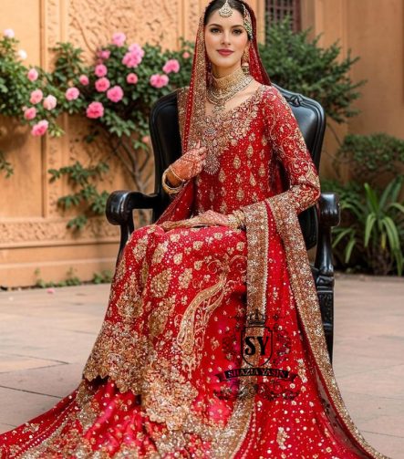 Radiating pure Amaranth Red bridal dress magic with two legged farshi lehenga. A perfect balance of grandeur and simplicity.