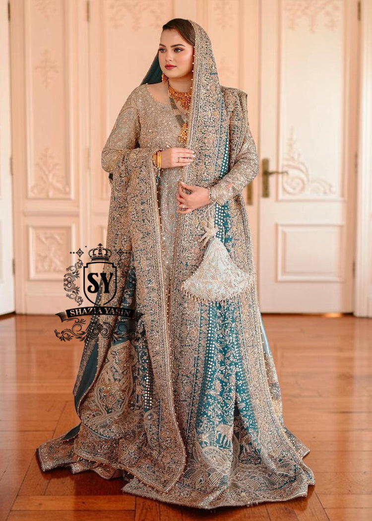 BridalDress236A A royal look for a Full-figured bride will be created by this A-line long shirt with farshi lehenga dress made of luxurious lame fabric in Tradewind color.
