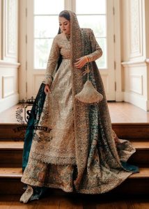 A royal look for a Full-figured bride will be created by this A-line long shirt with farshi lehenga dress made of luxurious lame fabric in Tradewind color.