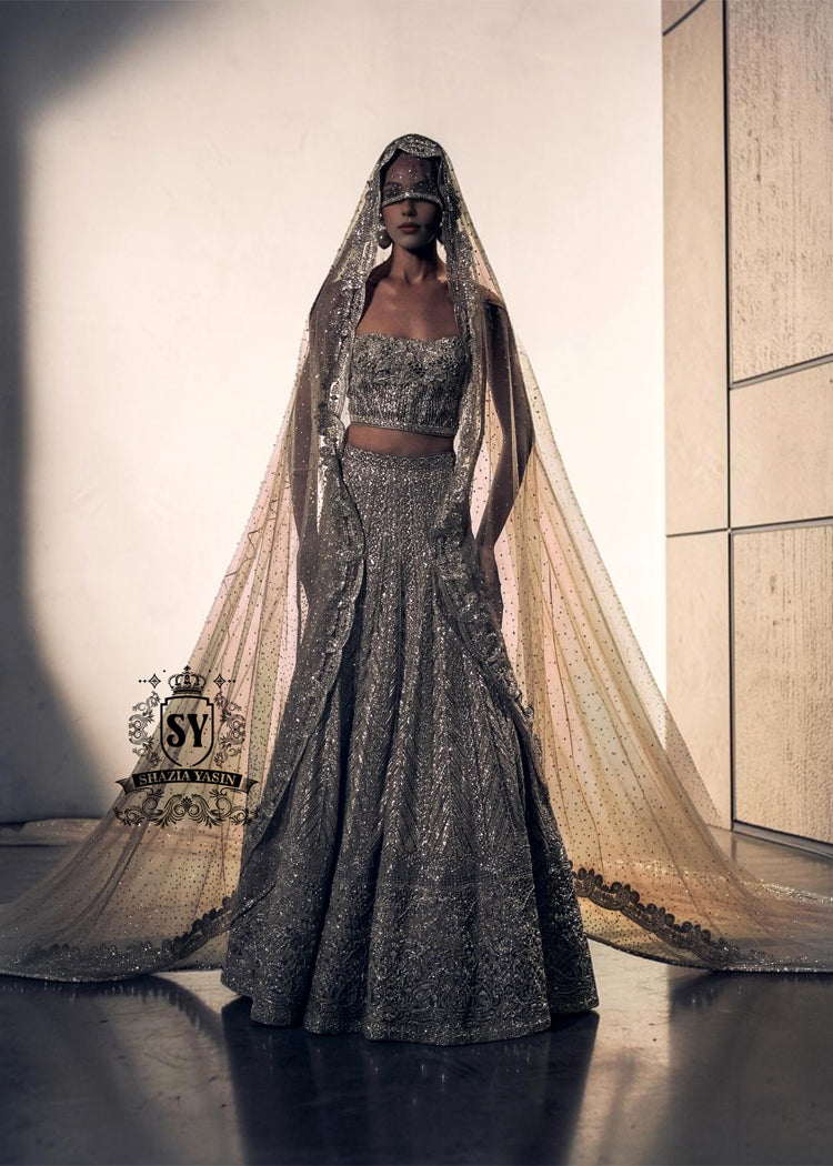 BridalDress244A A luxurious bridal look, created by designers to fulfill your dream of a magnificent, fairytale-like bridal dress. Imagine yourself dancing in this bridal Lehenga Choli dress at the wedding hall, and you'll never want anything else. It's a stunning, super contemporary Lehenga design that definitely won't go unnoticed.