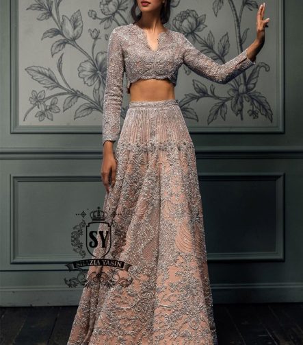 This bespoke bridal Lehenga choli dress is a celebration of romance and craftsmanship — adorned with tens of thousands of hand-sewn crystals that glisten like stardust on layers of ethereal tulle.