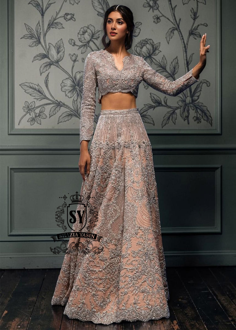BridalDress246A This bespoke bridal Lehenga choli dress is a celebration of romance and craftsmanship — adorned with tens of thousands of hand-sewn crystals that glisten like stardust on layers of ethereal tulle.