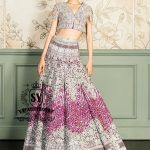 This Amaranth purple Lehenga choli Bridal dress is the embodiment of royal grandeur. A stunning wedding dress, every detail of which is designed to captivate. Exquisite embellishments, a sophisticated blouse, luxurious Beaded sleeves, and a delicate neckline create a truly aristocratic bride.