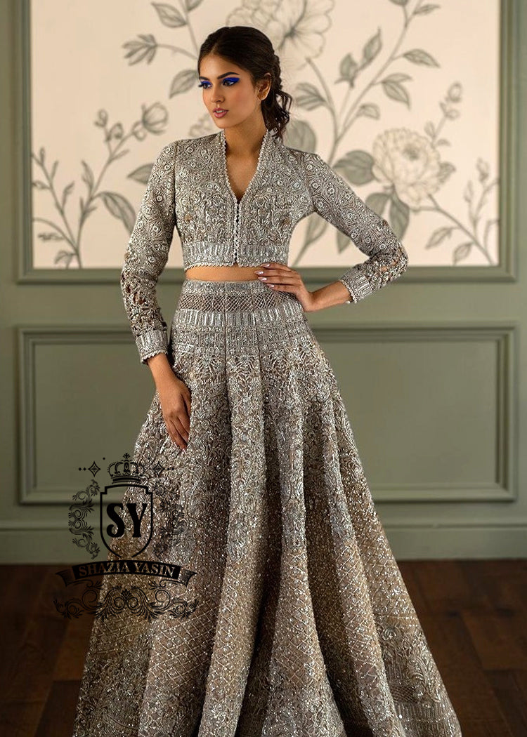 BridalDress248A This breathtakingly beautiful bridal lehenga choli wedding dress will make any bride feel like an angel. A brilliance lies in every detail. This wedding dress explores the interplay of light through layers of tulle embellishments and intricate embroidery.