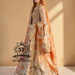 the Sultry beige color adds a modern touch to the traditional wedding dress. This ensemble is perfect for brides who want to combine classic elegance with contemporary fashion. A premium Pishwas Lehenga design ideal for brides seeking an elegant, sophisticated, and striking look.