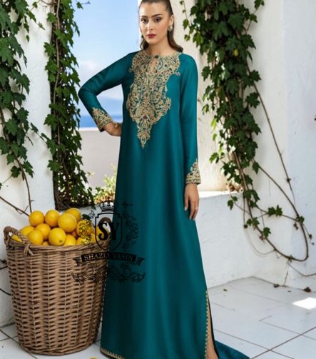 As wedding season blooms, make a sophisticated statement with our exquisite Teal Kaftan dress, crafted from pure raw silk and embellished with intricate dapka, naqshi, and cutdana embroidery. Every detail is carefully designed to highlight your unique radiance and individuality, perfect for any special occasion where you want to be the most spectacular.