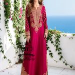 Truly stunning. This Big dip o’ruby raw silk Kaftan is perfect for evening occasions. Delicate Marori embroidery by skilled artisans adorns the sleeves and hem, creating a classic feel. For any celebration this season.