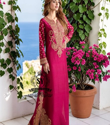 Truly stunning. This Big dip o’ruby raw silk Kaftan is perfect for evening occasions. Delicate Marori embroidery by skilled artisans adorns the sleeves and hem, creating a classic feel. For any celebration this season.