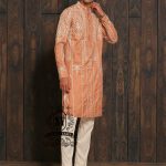 Expertly embroidered for a sophisticated look, the SY Couture Peach Men's Kurta Pajama is the perfect blend of style and comfort. Made with high-quality fabric, it features an elegant design and superior stitching for a lasting impression. Elevate your wardrobe with this timeless piece for any occasion.