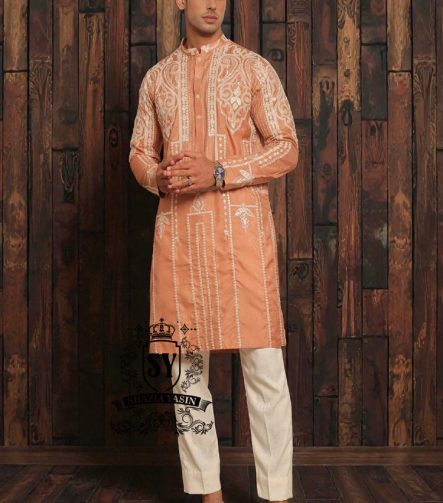 Expertly embroidered for a sophisticated look, the SY Couture Peach Men's Kurta Pajama is the perfect blend of style and comfort. Made with high-quality fabric, it features an elegant design and superior stitching for a lasting impression. Elevate your wardrobe with this timeless piece for any occasion.