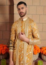 A luxurious mustard-gold kurta adorned with delicate floral and geometric embroidery — created for the man who believes in elegance, heritage, and refined festive style.