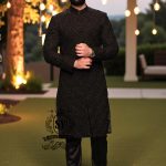 A sophisticated Black classic sherwani, and beautifully executed with intricate hand embroidery featuring sequins and beads. It is designed for versatility.