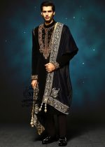 This jet black cocktail velvet form-fitting sherwani is the epitome of elegance. Its impeccable design and luxurious velvet fabric exude a touch of royalty.