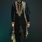 This jet black cocktail velvet form-fitting sherwani is the epitome of elegance. Its impeccable design and luxurious velvet fabric exude a touch of royalty.