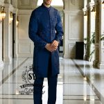 This Admiral Blue sherwani redefines elegance with its intricately executed tone-on-tone adah work, exuding a royal aura with a distinctive modern edge, embodying royal sophistication yet suited to the modern man.